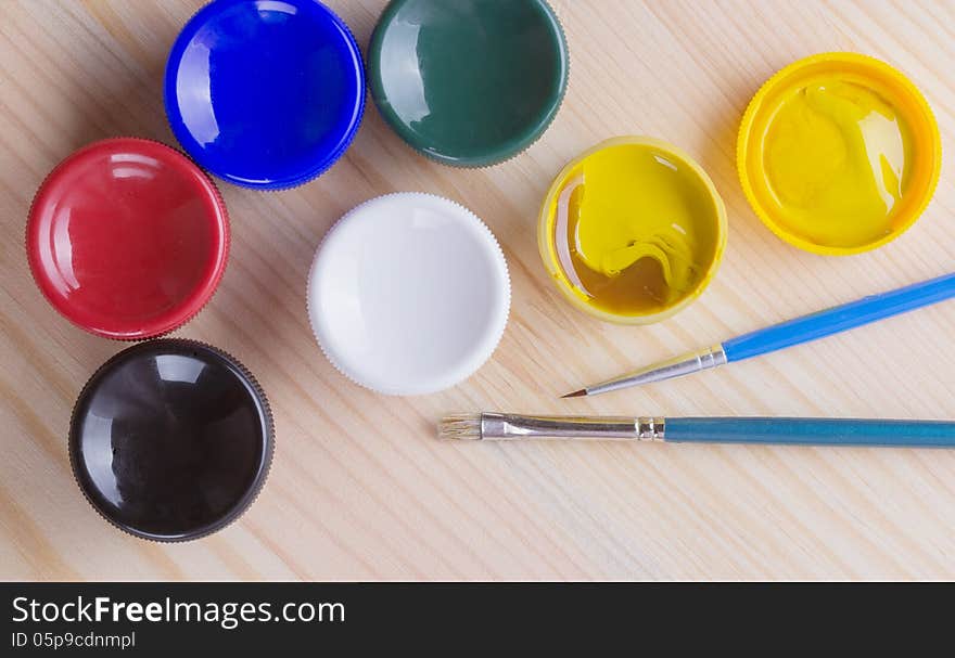 Brush And Many Paint Jars