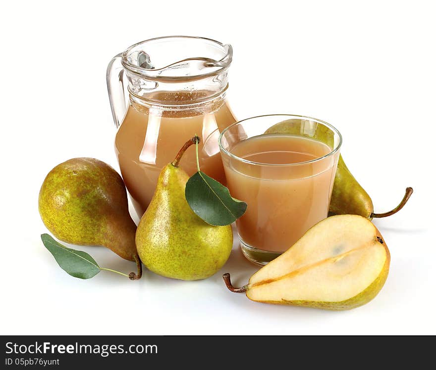 Pear juice in a jug and a glass of fruit. Pear juice in a jug and a glass of fruit