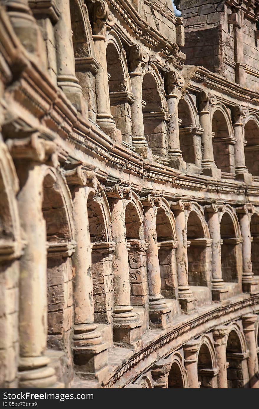 Ancient arched wall summer day