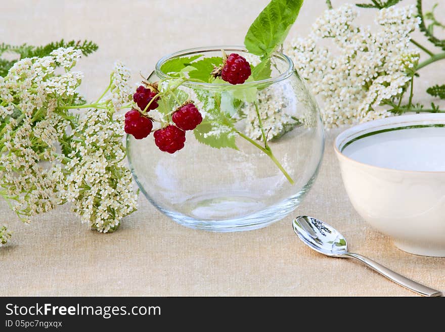 Bunch of raspberries in a glass bowl