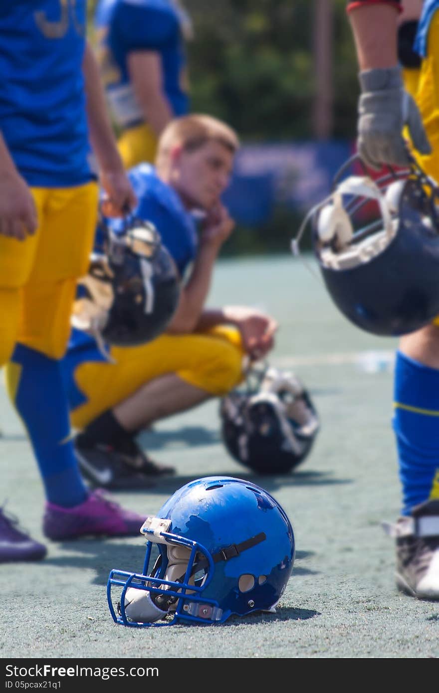 American football players are resting during a match