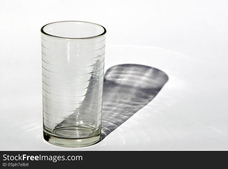 An empty water cup on a white background.