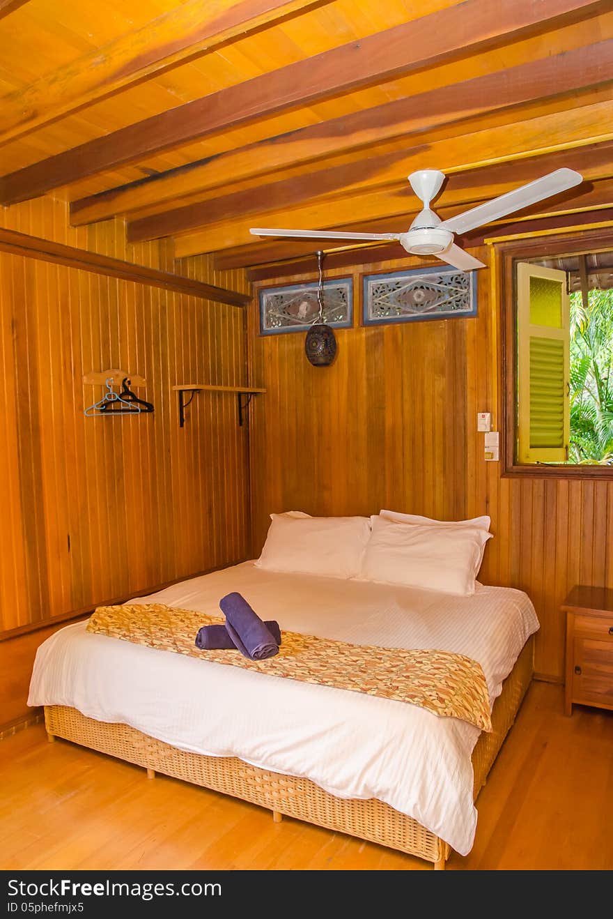 Wooden Resort Room With Bed