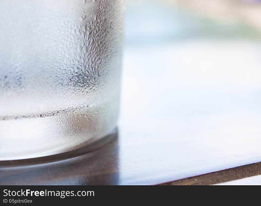 Cool Glass On Wooden Table And Dew