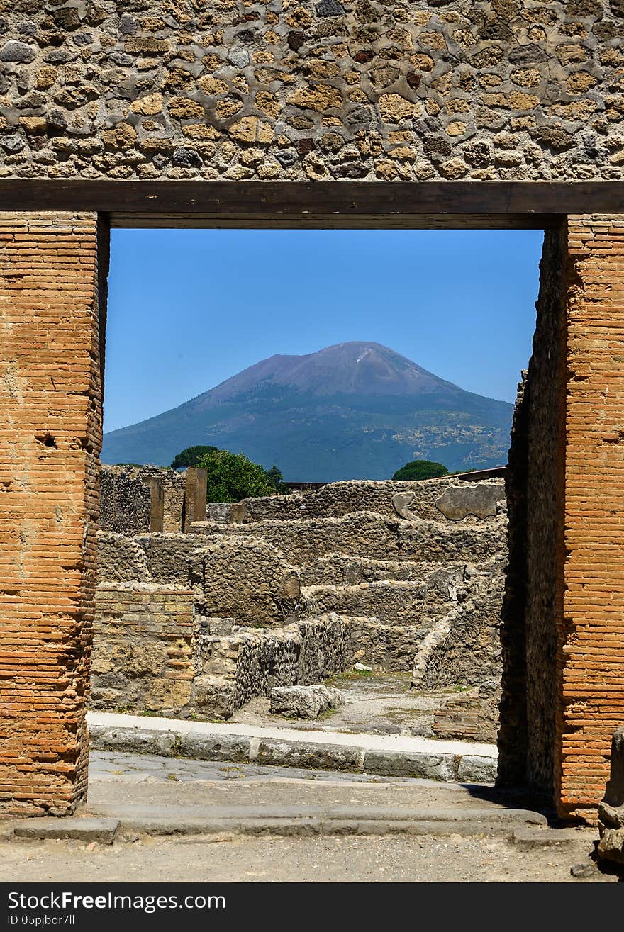 Ruins of Pompeii with Mt. Vesuvius in the background. Photo taken in June of 2013. Ruins of Pompeii with Mt. Vesuvius in the background. Photo taken in June of 2013