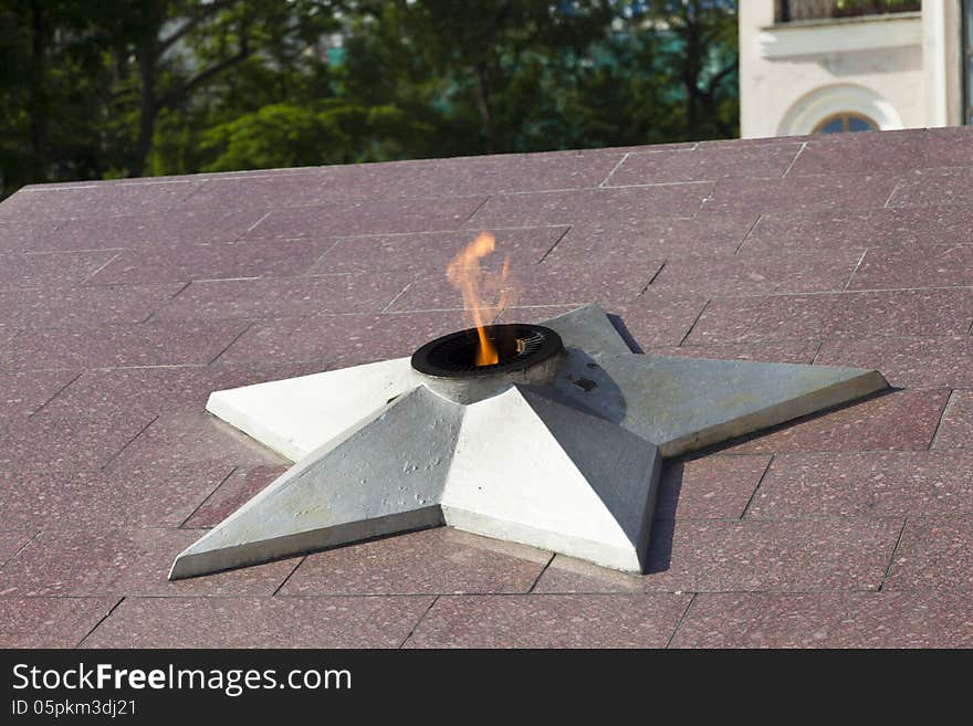 The eternal flame burns on a monument in honor of the lost soldiers