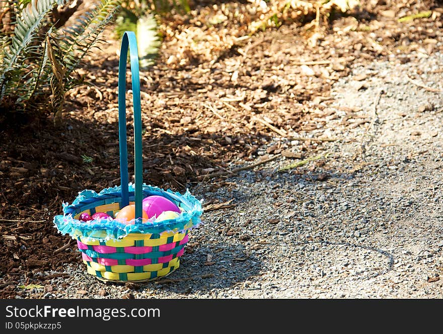 A child's Easter Egg basket full of chocolate eggs. A child's Easter Egg basket full of chocolate eggs