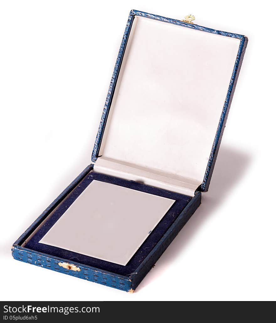 Silver medal in old blue box on white background. Silver medal in old blue box on white background.