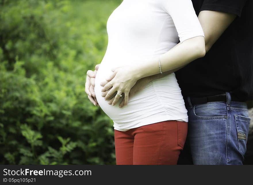 A belly of a beautiful pregnant woman. A belly of a beautiful pregnant woman