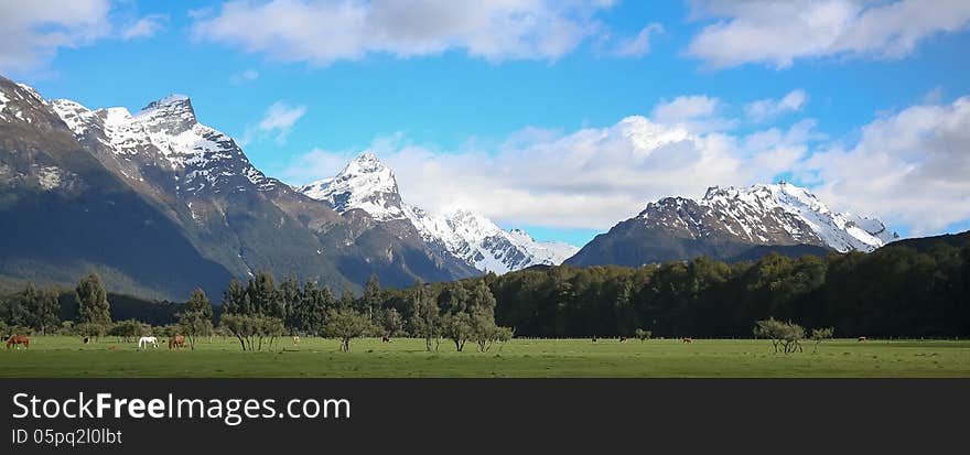 Spectacular snow-capped mountains rise from the famous Glenorchy region of New Zealand. Spectacular snow-capped mountains rise from the famous Glenorchy region of New Zealand.