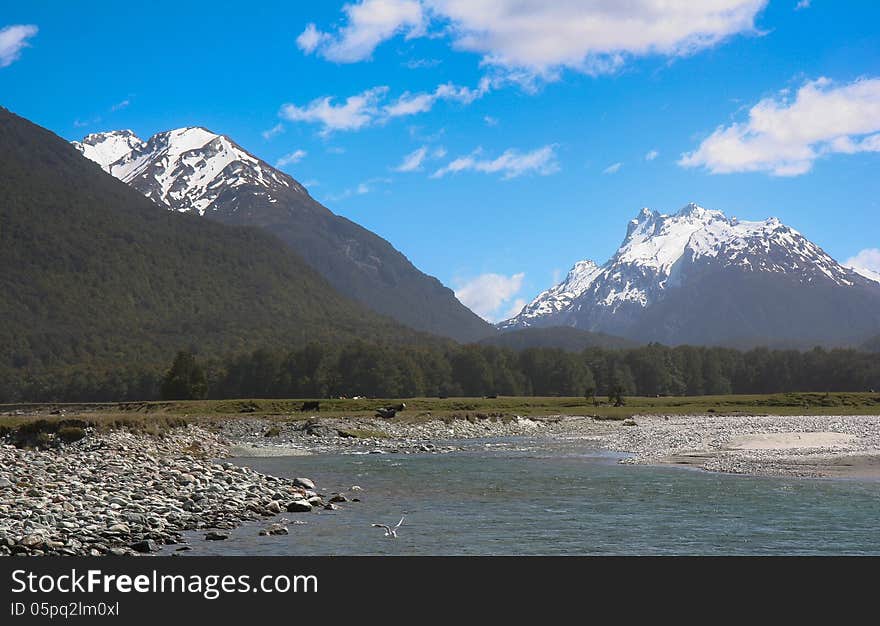 Spectacular snow-capped mountains rise from the famous Glenorchy region of New Zealand. Spectacular snow-capped mountains rise from the famous Glenorchy region of New Zealand.