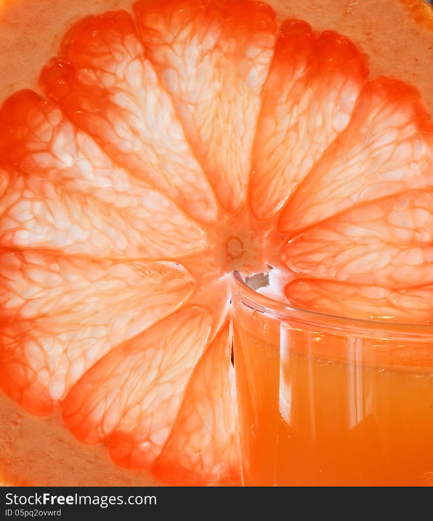 Glass of grapefruit juice with a slice of grapefruit