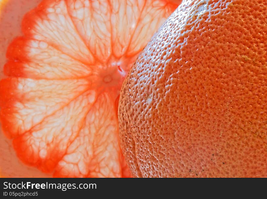 Glass of grapefruit juice with a slice of grapefruit