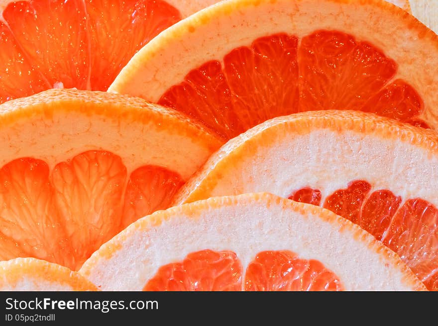 Glass of grapefruit juice with a slice of grapefruit