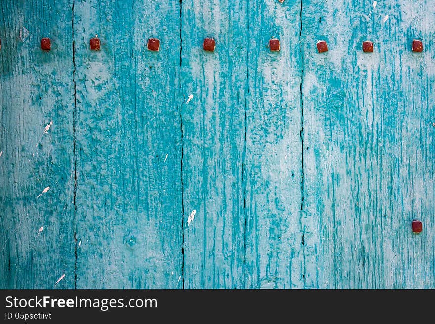 Blue wood abstract background from a door in Southern Italy