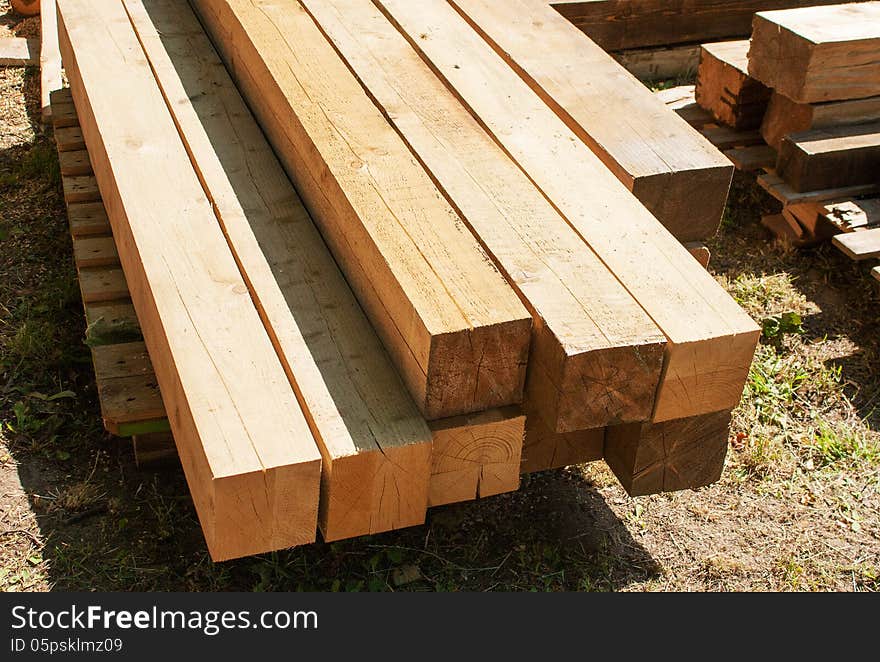 Wooden boards for construction outside on summer day