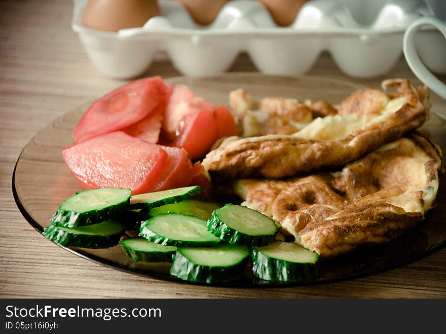 Tomelette with cucumbers and tomatoes for breakfast. Tomelette with cucumbers and tomatoes for breakfast