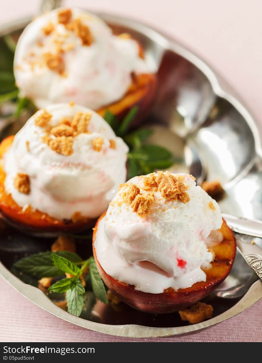 Grilled peaches and ice cream dessert. Grilled peaches and ice cream dessert