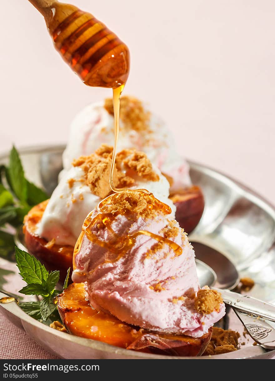 Grilled peaches and ice cream dessert. Grilled peaches and ice cream dessert