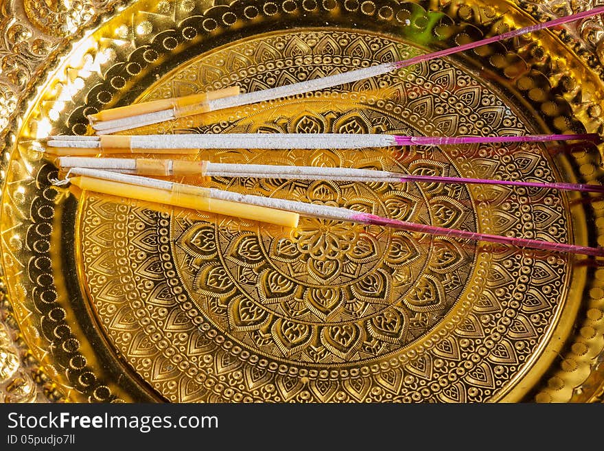 Candle with joss stick ontray with pedestal prepare for buddhist to makw worship.