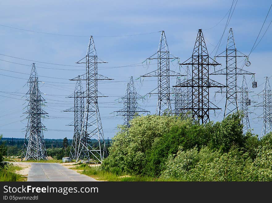 Power mast against the sky with shrub. Power mast against the sky with shrub