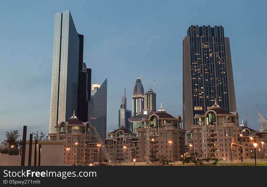 Dubai downtown night scene with city lights, luxury new high tech town in middle East, United Arab Emirates architecture. Dubai downtown night scene with city lights, luxury new high tech town in middle East, United Arab Emirates architecture