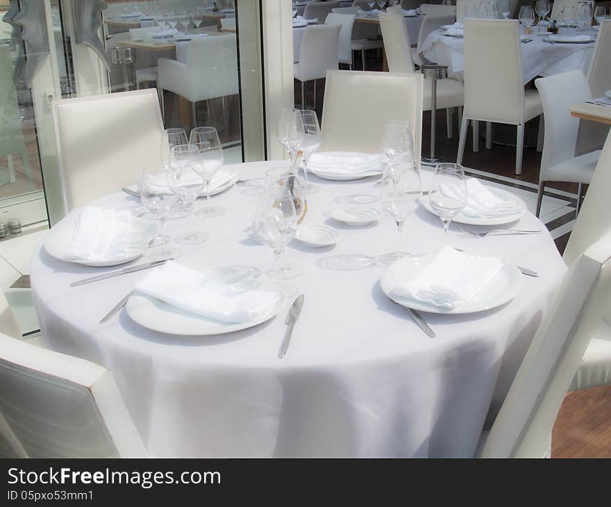 White restaurant awaits guests in the afternoon. White restaurant awaits guests in the afternoon