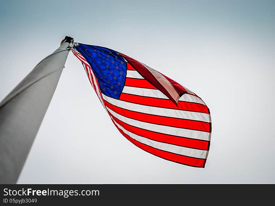 Close Up looking at a US flag flying. Close Up looking at a US flag flying