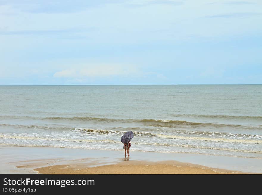 Girl On Beach With Umbella