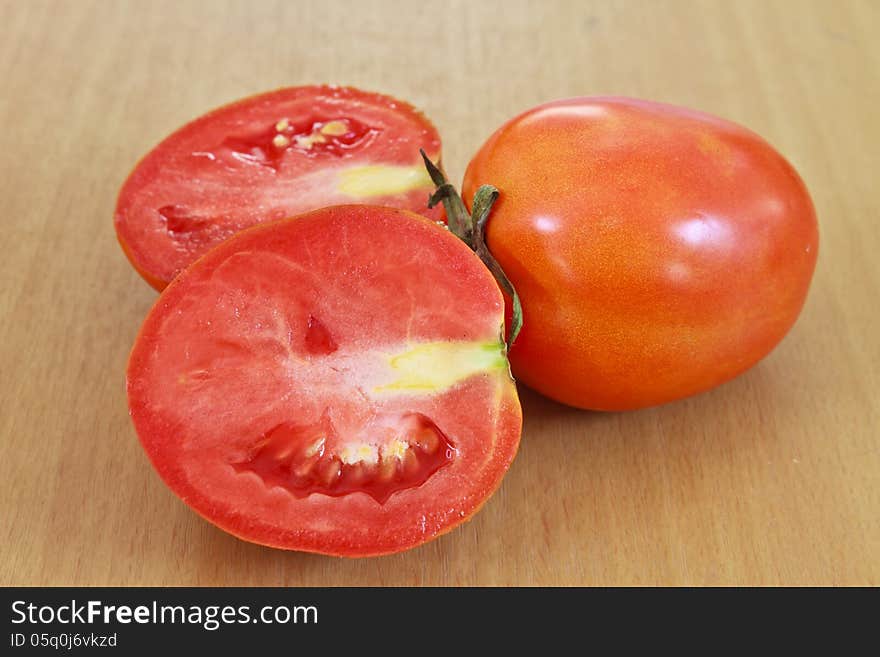 Tomatos on wood table background