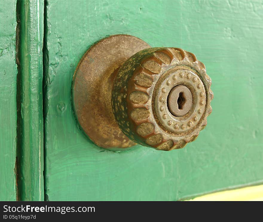 Vintage door knob on old wooden door