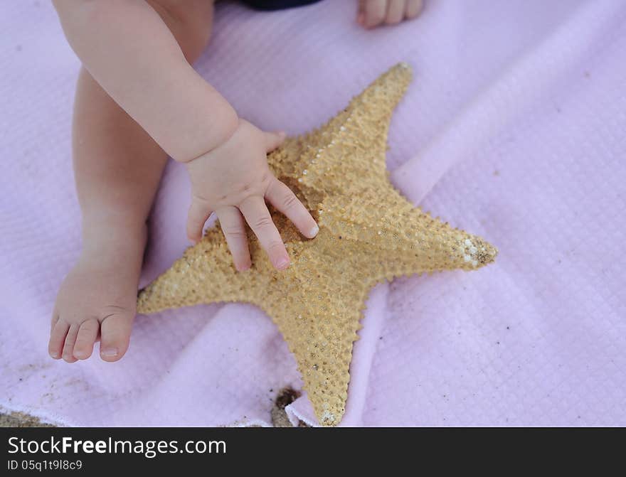 Little baby foot and handle holds great starfish