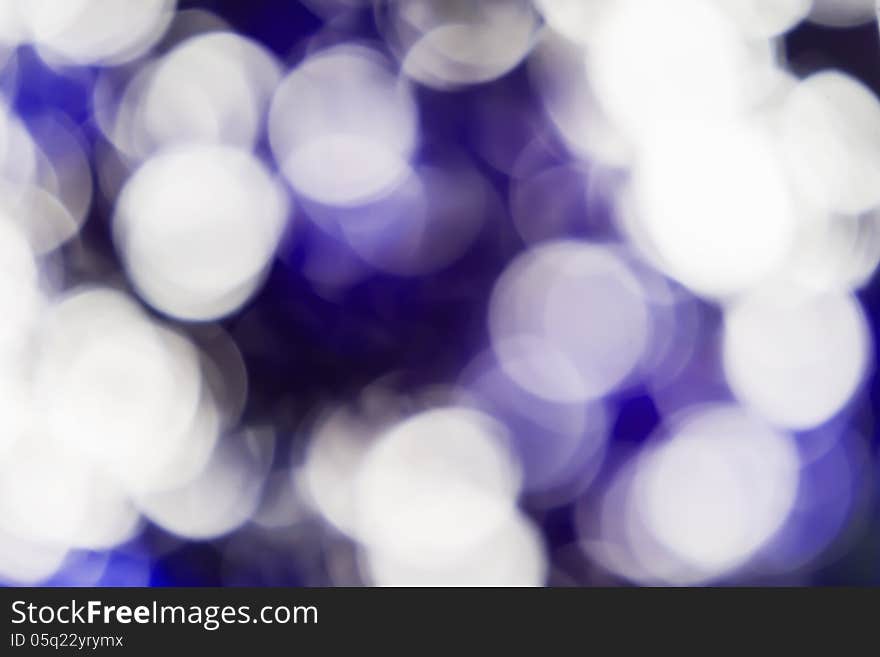 Blurred lights violet bokeh abstract light background