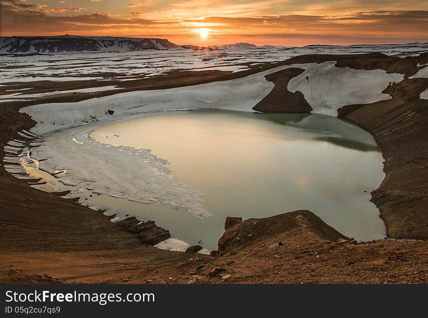 Midnight sunset over Viti crater in Krafla volcanic area, Iceland. Midnight sunset over Viti crater in Krafla volcanic area, Iceland.