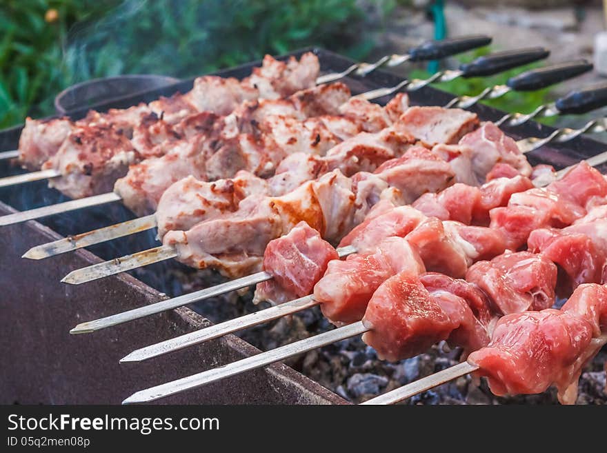 Shish Kebab In Process Of Cooking On Open Fire Outdoors