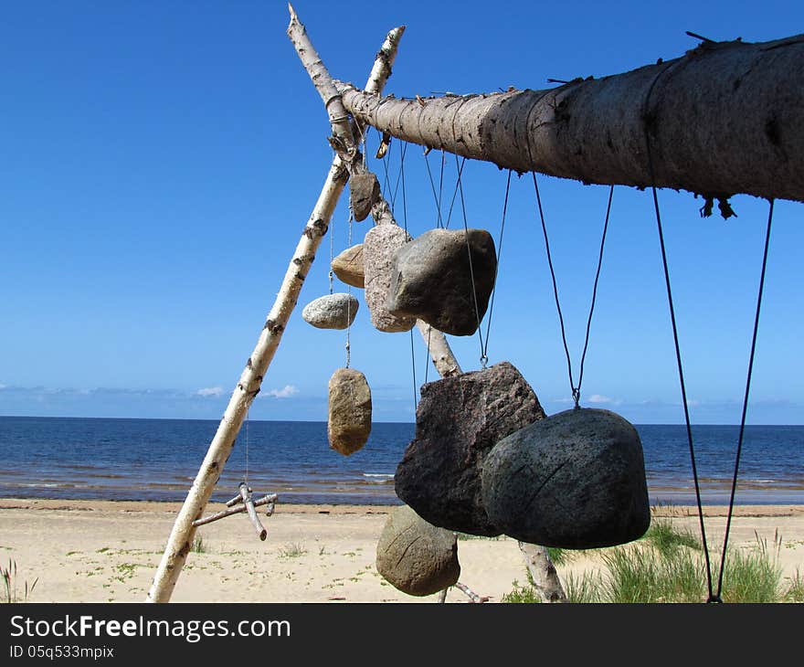 Funeral stones suspended on wooden poles.