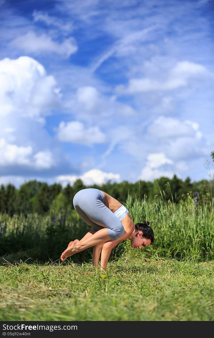 Young woman doing yoga outdoor