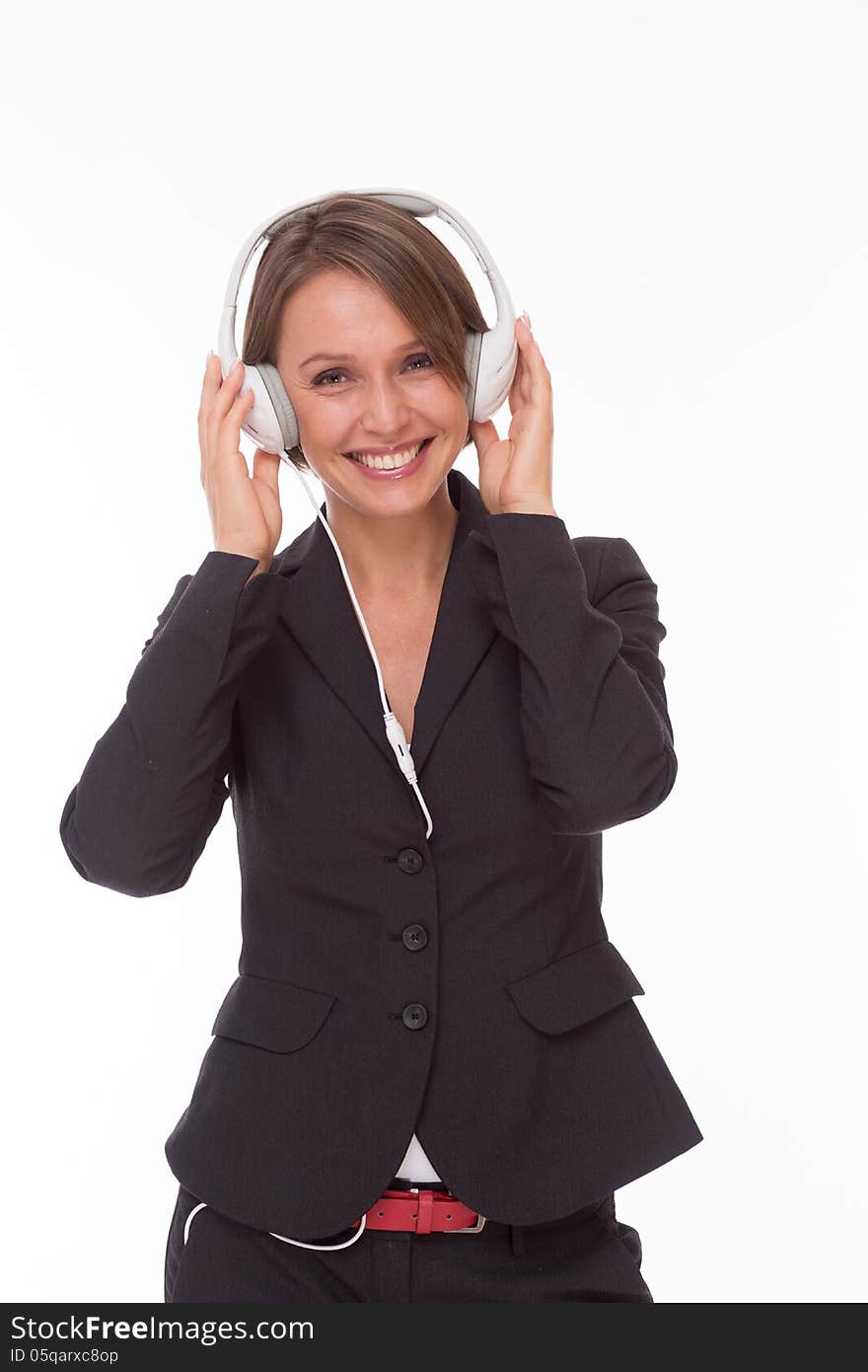 Businesswoman with earphones smiling isolated on white. Businesswoman with earphones smiling isolated on white