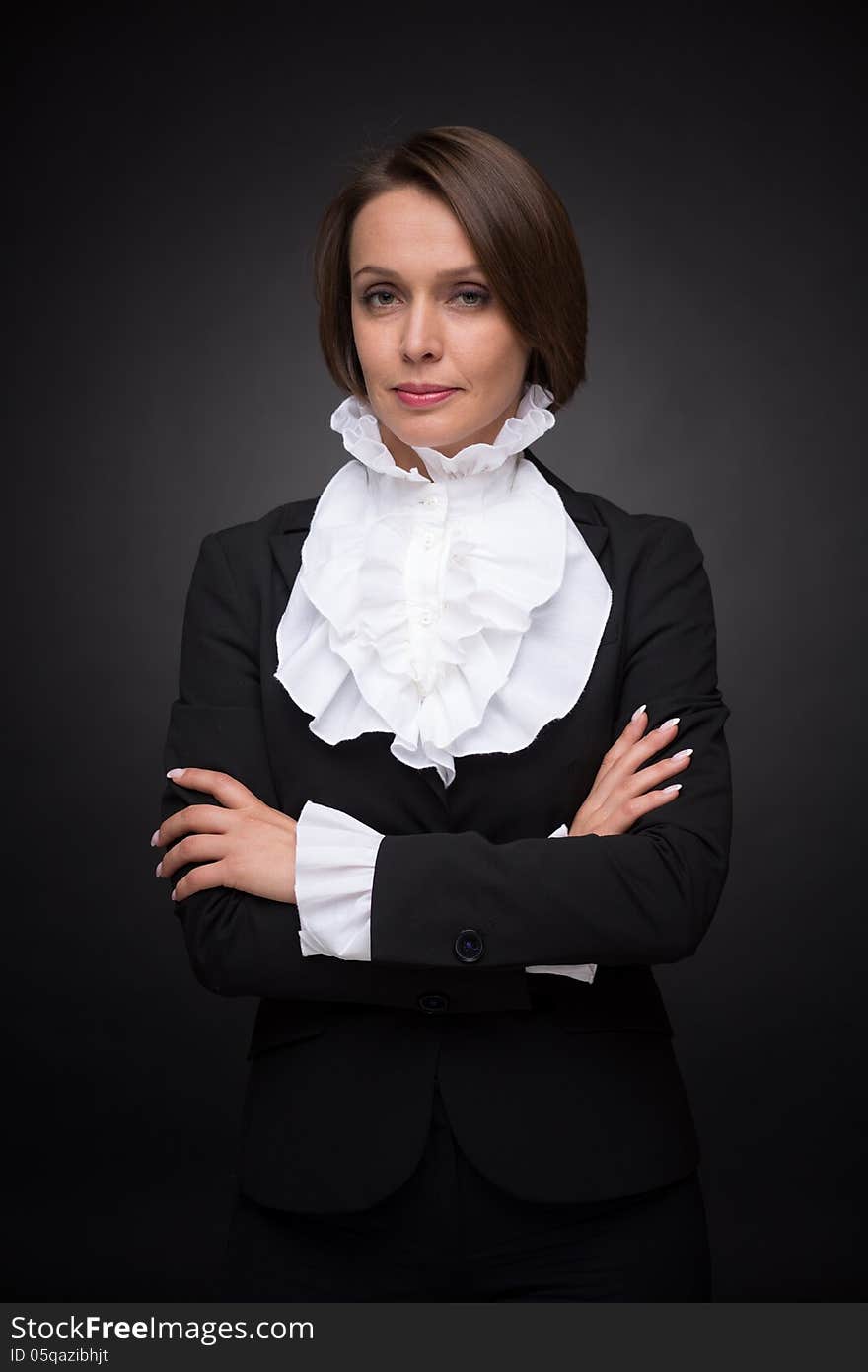 Business woman on dark grey background