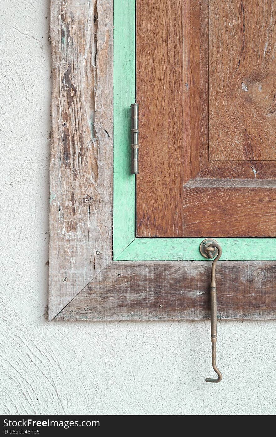 Wooden window frame with concrete wall