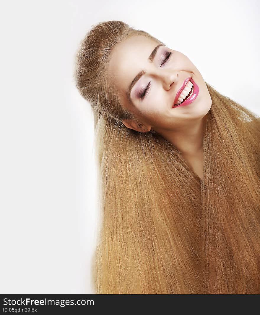 Sincere Smile. Jubilant Young Woman with Flowing Healthy Hairs. Pleasure