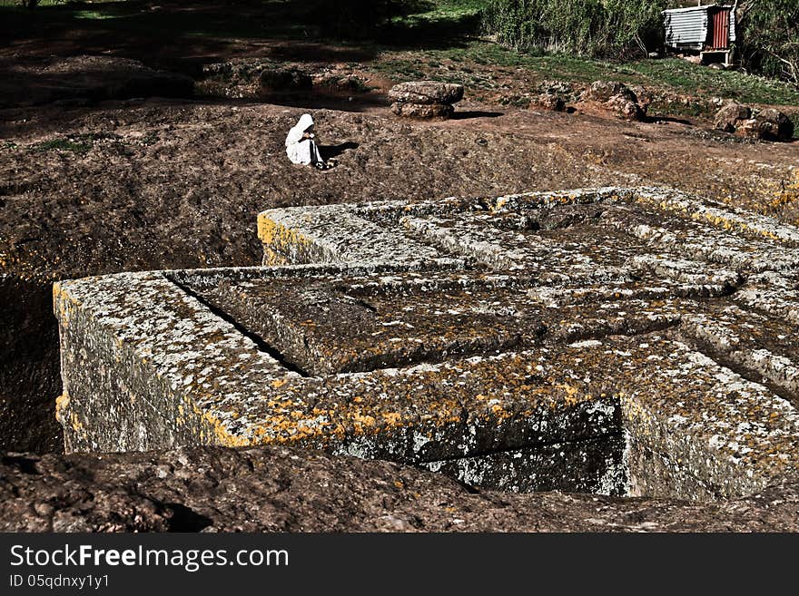 Praying at Church of Saint George, Lalibela