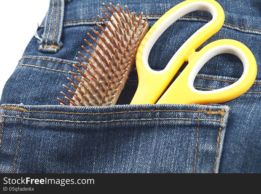 Hair cut tool in jean's pocket in white background. Hair cut tool in jean's pocket in white background