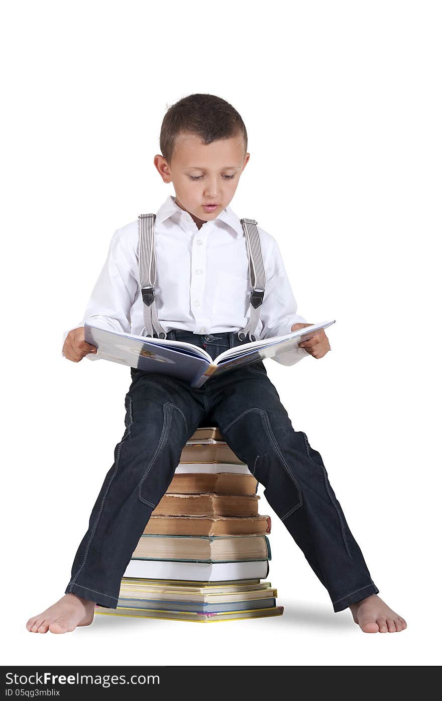 Boy Sitting On A Pile Of Books