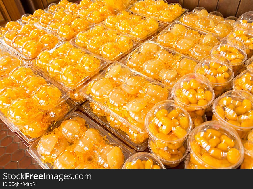 Traditional Thai Dessert in plastic box on shelf .Egg yoke fudge balls cooked in syrup, Golden threads, Bean-paste,. Traditional Thai Dessert in plastic box on shelf .Egg yoke fudge balls cooked in syrup, Golden threads, Bean-paste,