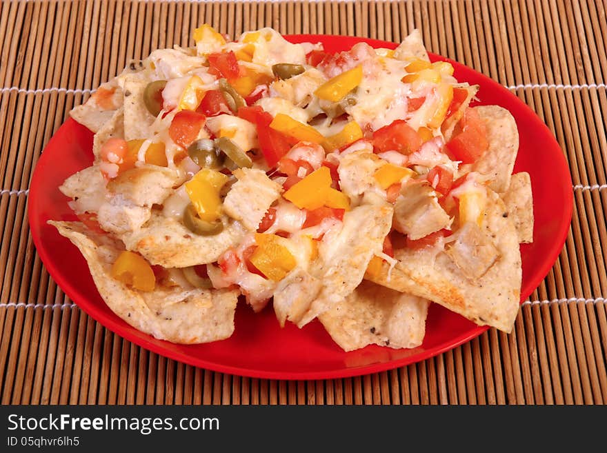 Cheese and chicken nachos plate