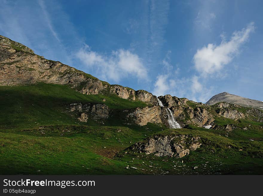 If the snow in the mountains is fusing the water is flow as a waterfall tho the valley. If the snow in the mountains is fusing the water is flow as a waterfall tho the valley.