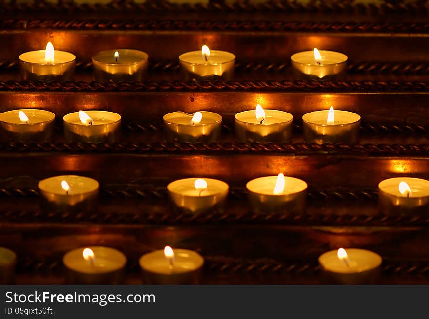 Burning candles in the Catholic Church