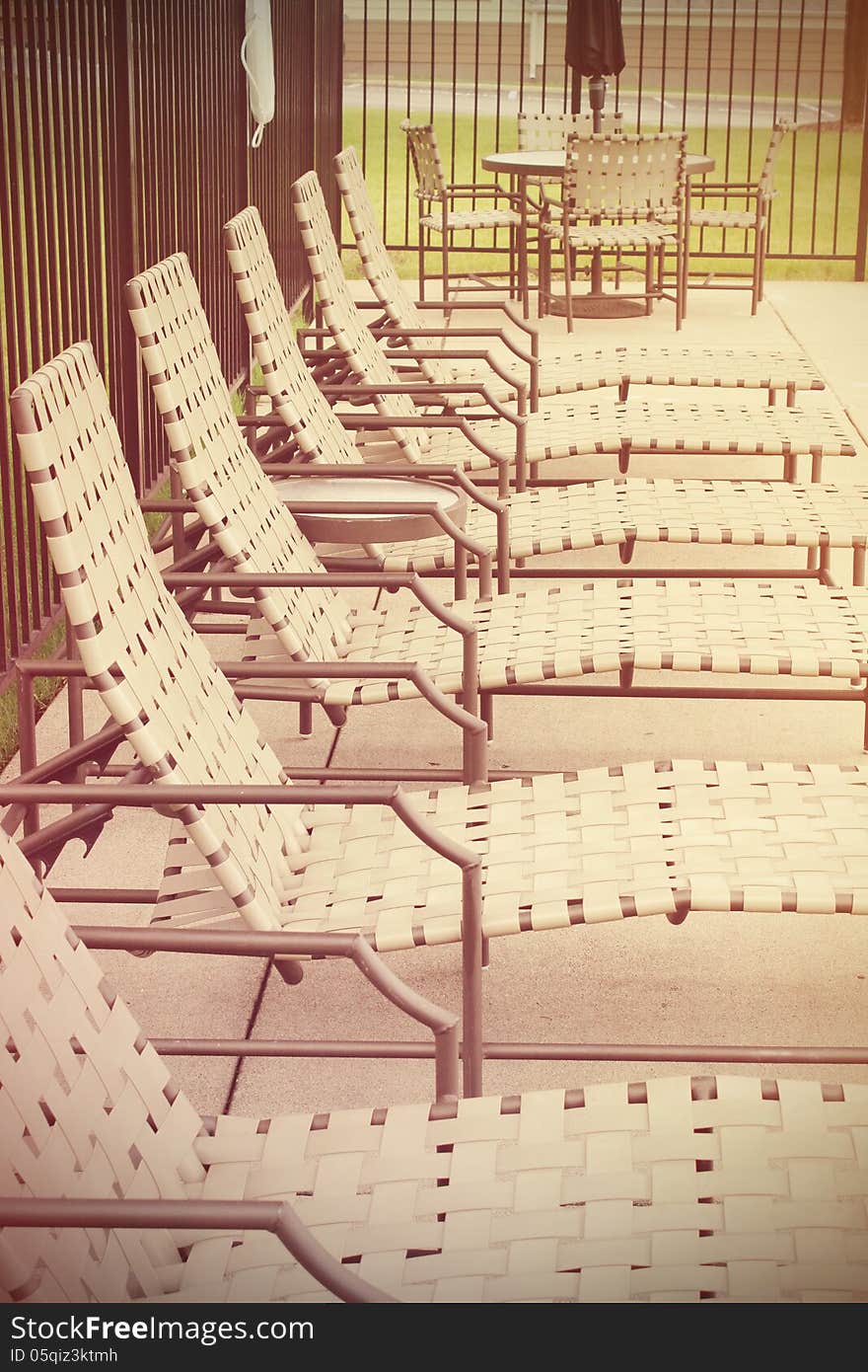 Row of deck chairs by the pool