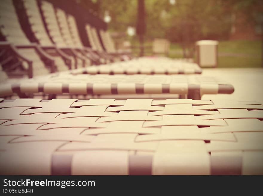 Row of deck chairs by the pool